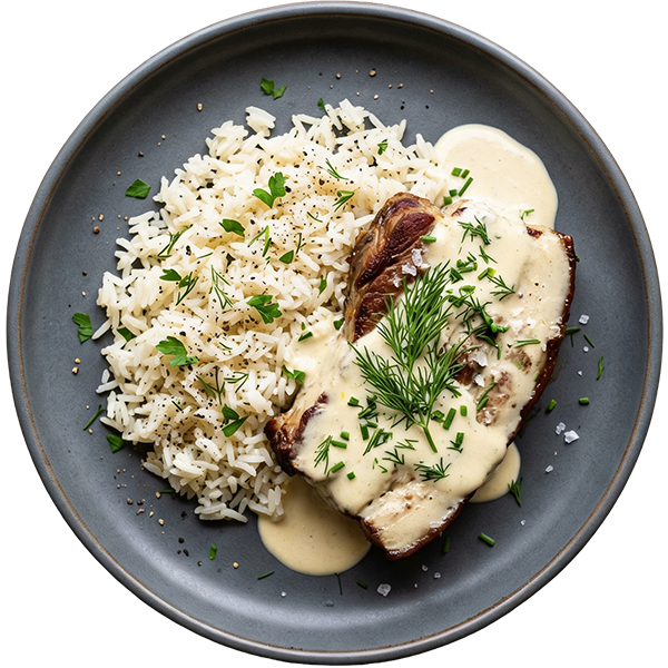 Boneless pork chop in herb sauce with rice
