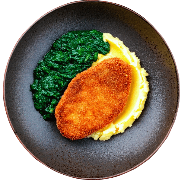 Breaded pork cutlet with mashed potatoes and spinach